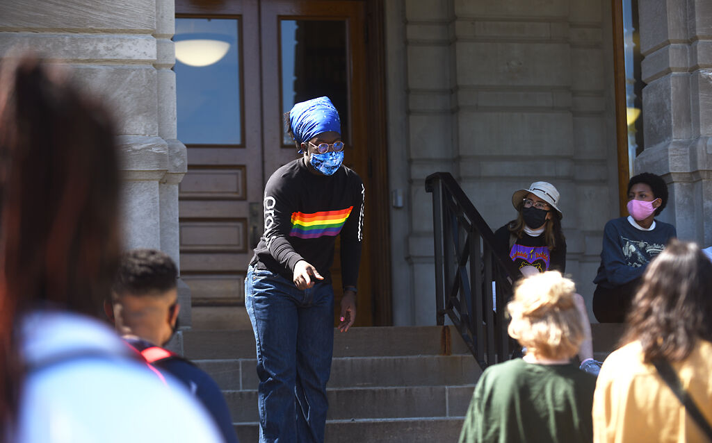 A student leads a chant after the march